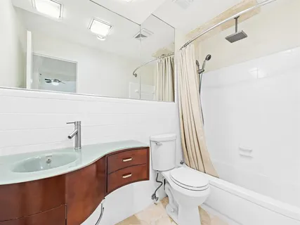 a view of a bedroom with a bed and cabinet