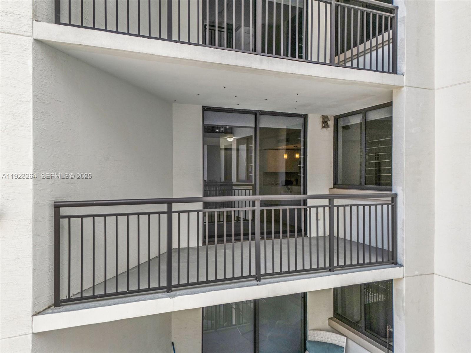 999 Southwest 1st Avenue, Unit 2801 Miami, FL 33130 - Photo 17 of 42 a view of a wooden balcony