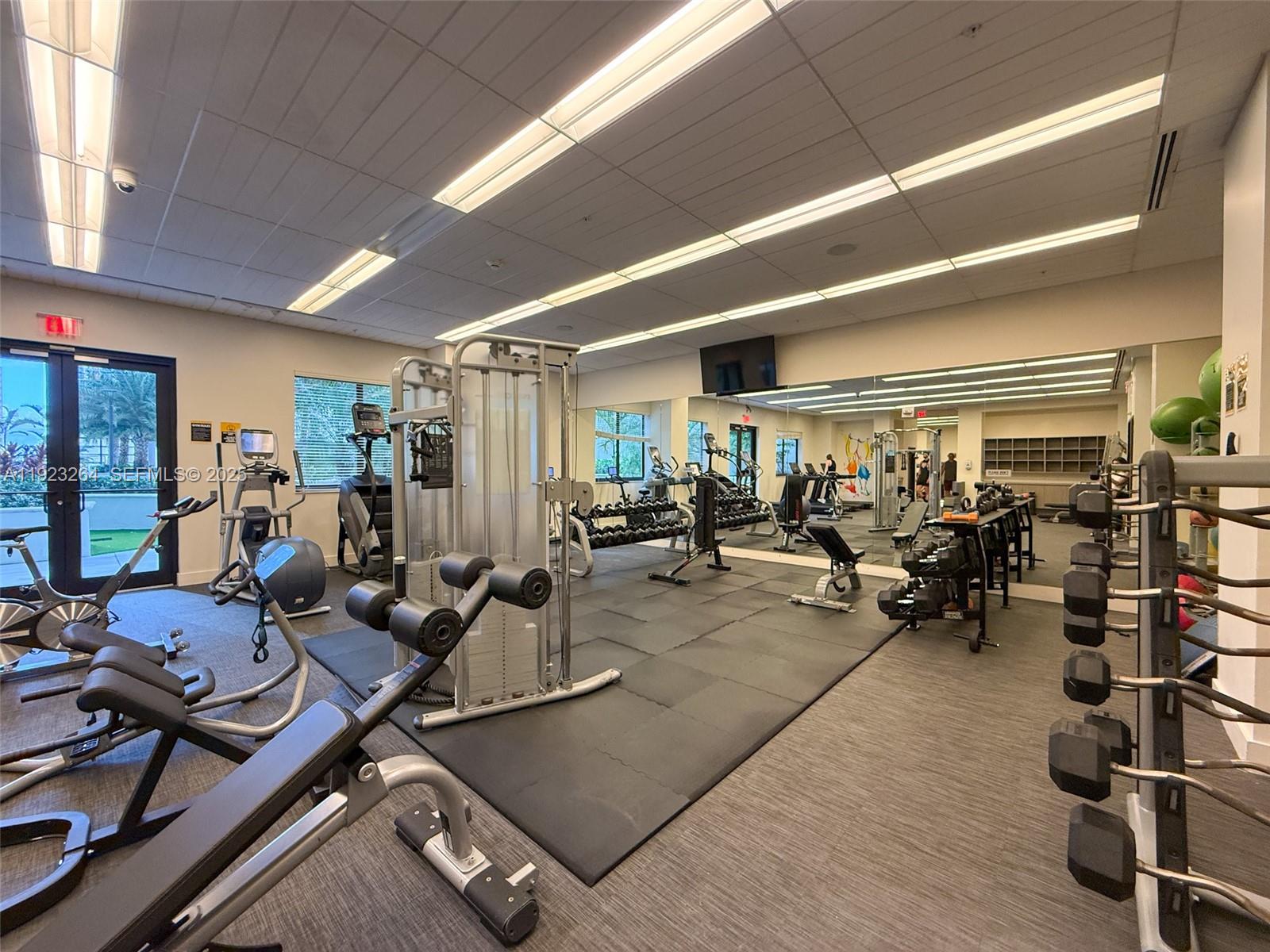 999 Southwest 1st Avenue, Unit 2801 Miami, FL 33130 - Photo 20 of 42 a view of a room with gym equipment