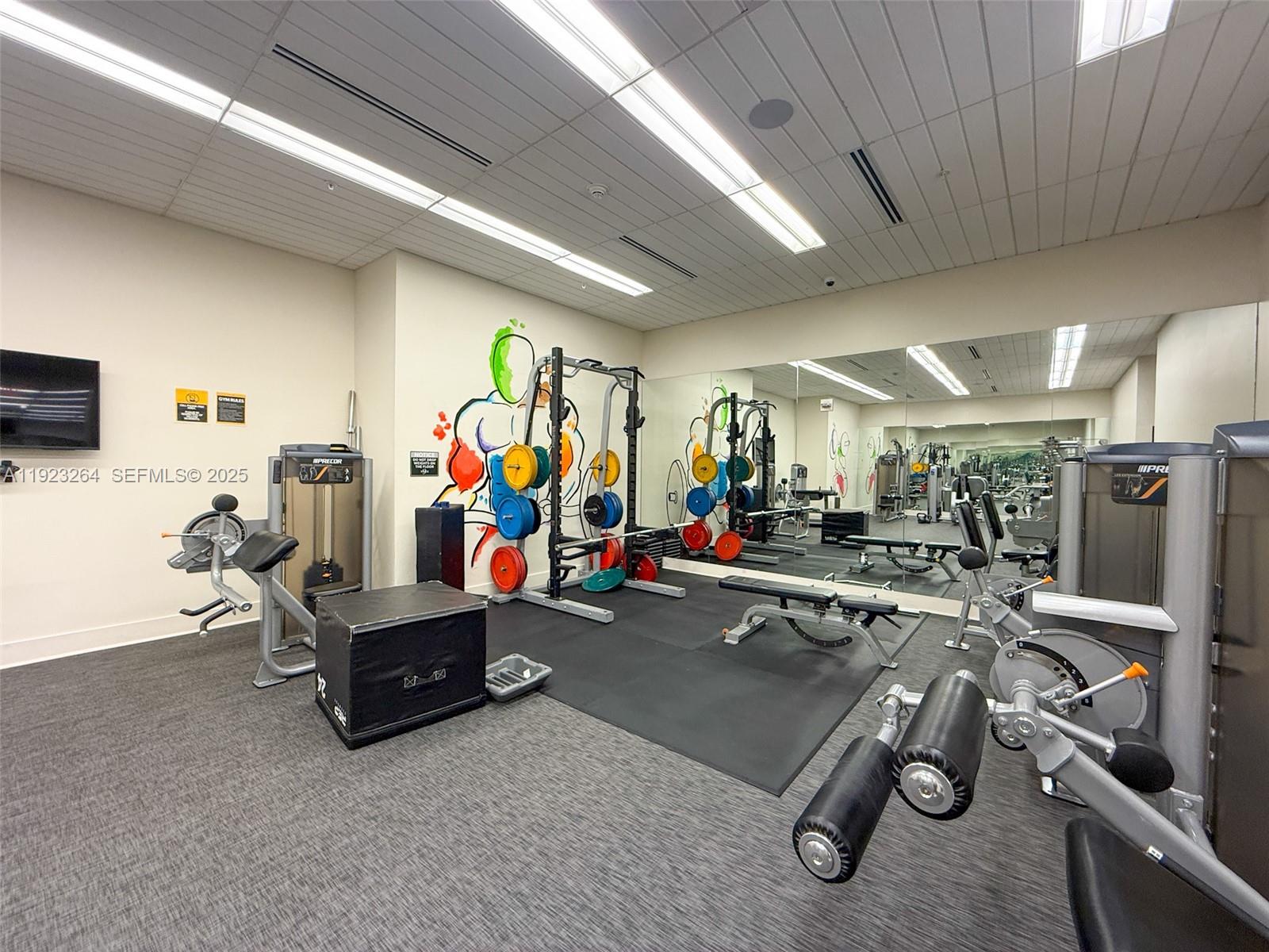 999 Southwest 1st Avenue, Unit 2801 Miami, FL 33130 - Photo 22 of 42 a view of a room with gym equipment