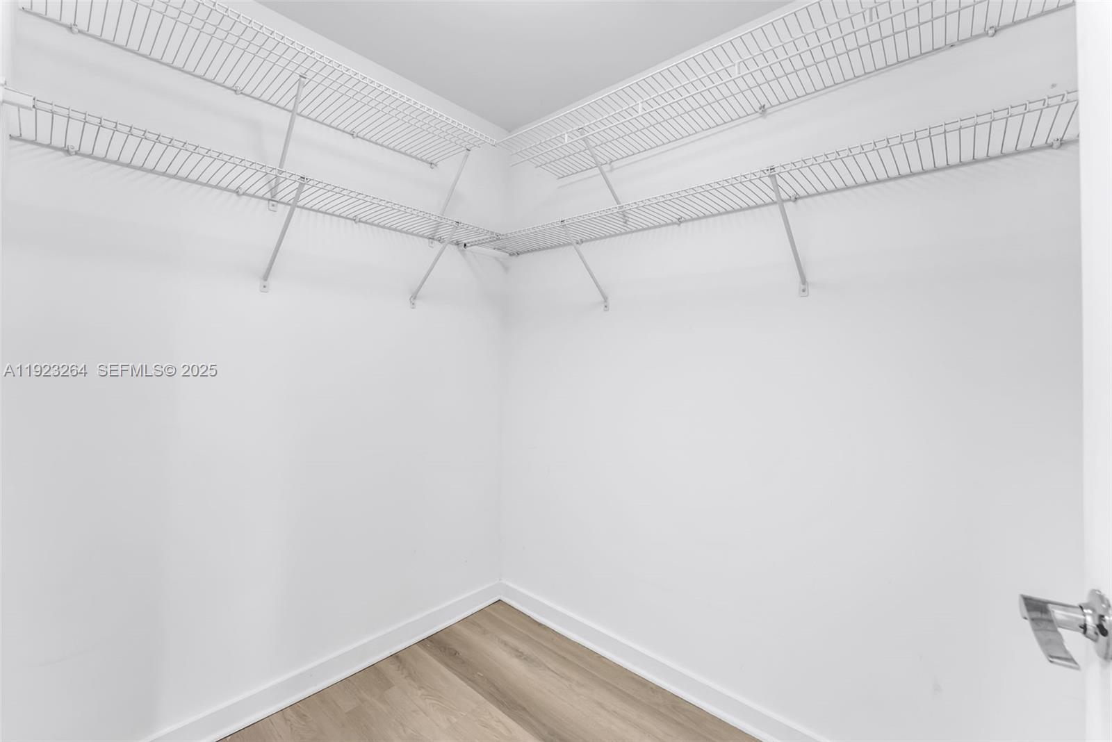 999 Southwest 1st Avenue, Unit 2801 Miami, FL 33130 - Photo 10 of 42 a view of a room with racks on the wall