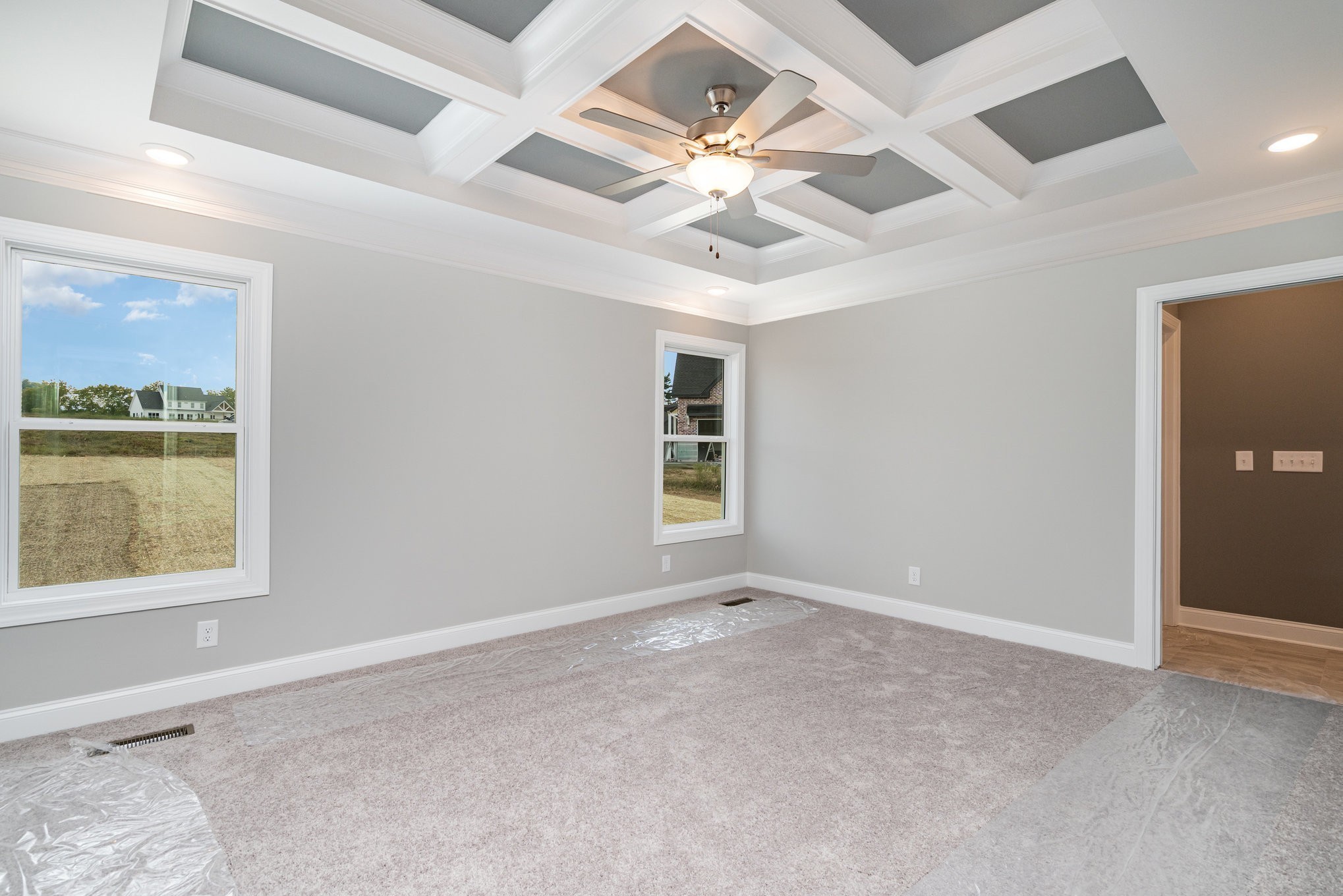 1815 Sulphur College Road Hartsville, TN 37074 - Photo 16 of 36 an empty room with windows and fan