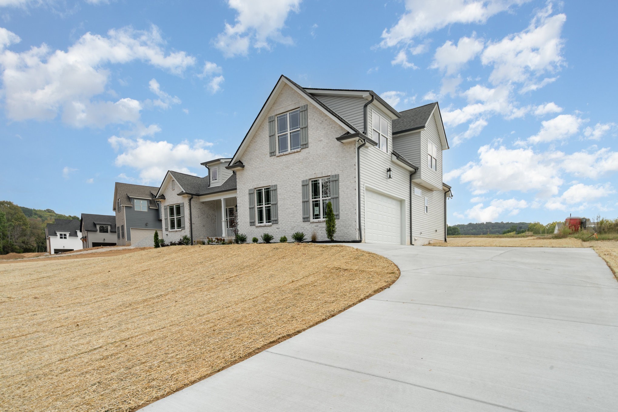 1815 Sulphur College Road Hartsville, TN 37074 - Photo 2 of 36 a front view of a house with a yard and garage