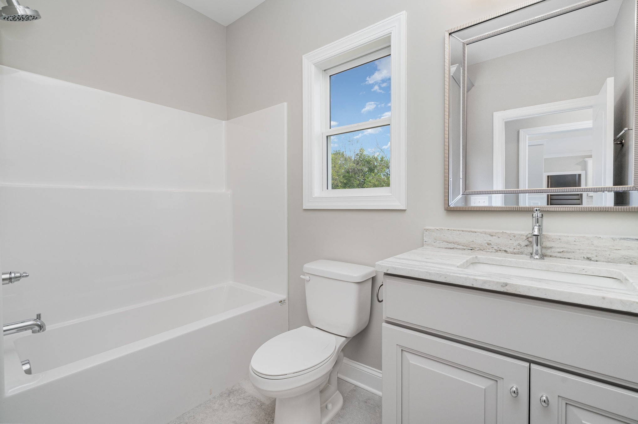 1815 Sulphur College Road Hartsville, TN 37074 - Photo 24 of 36 a bathroom with a granite countertop toilet a sink and a bathtub