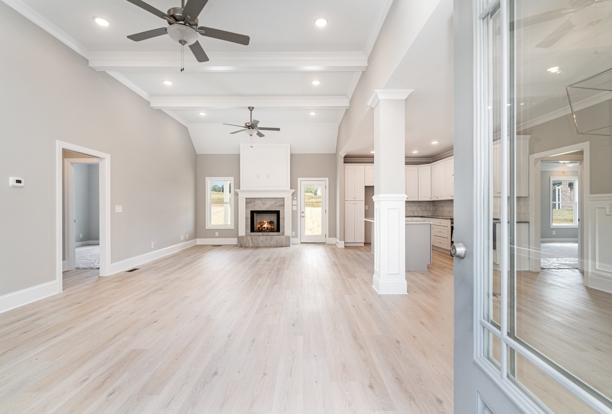 1815 Sulphur College Road Hartsville, TN 37074 - Photo 6 of 36 wooden floor in an empty room with a fireplace