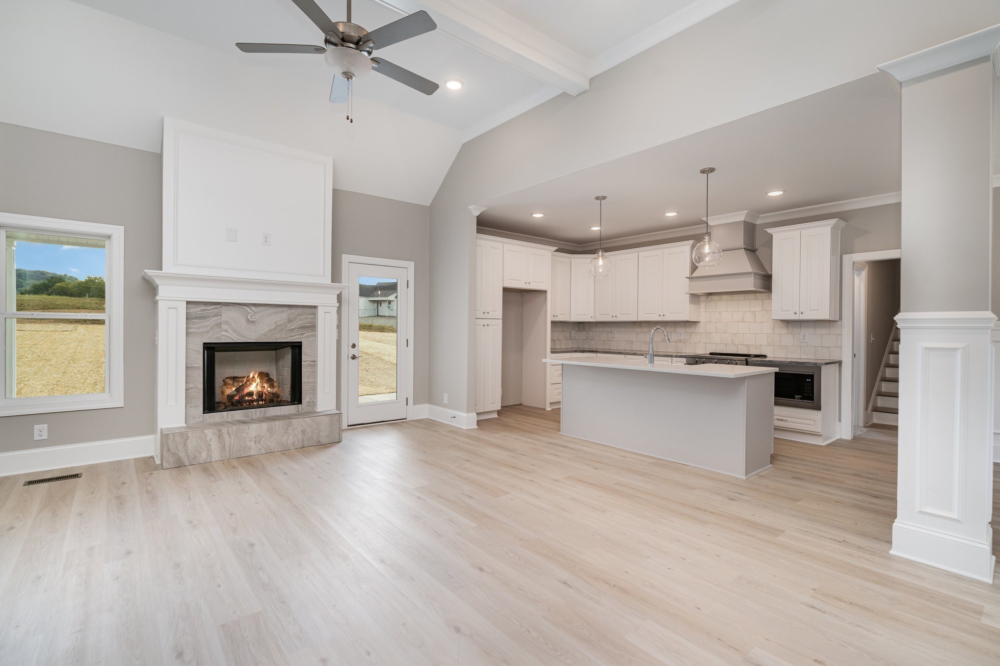 1815 Sulphur College Road Hartsville, TN 37074 - Photo 7 of 36 a view of kitchen with kitchen island wooden floor and a fireplace