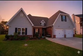 a living room with fireplace furniture and a flat screen tv