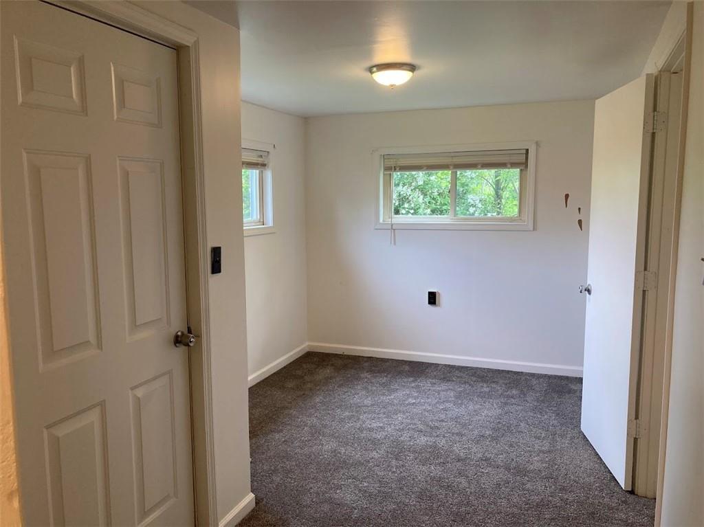 4974 Williamsport Road Elizabeth, PA 15037 - Photo 19 of 34 an empty room with wooden floor and windows