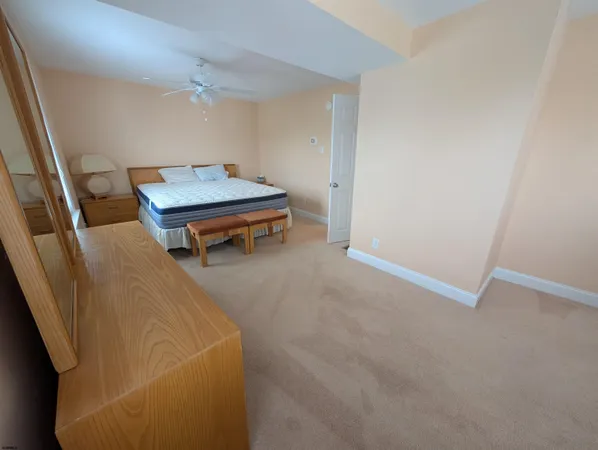 a living room with a couch and wooden floor