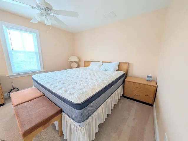 a living room with a table and a chandelier