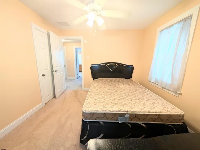 a room with a table and bed