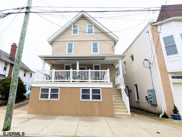 a front view of a house with a garage
