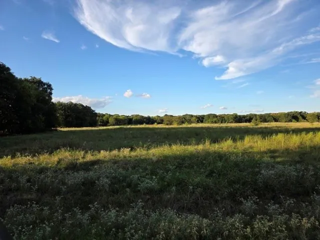 a view of mountain with lake in background