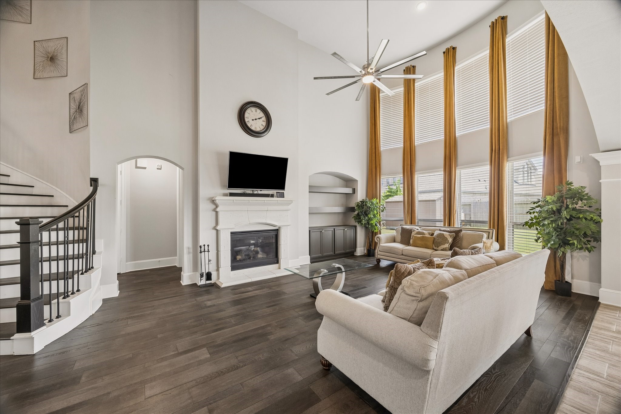 1907 Sapphire Pines Lane Rosenberg, TX 77469 - Photo 7 of 43 FAMILY ROOM FEATURES CUSTOM BUILT-IN CABINETRY AND AN EXPANSIVE WALL OF FLOOR TO CEILING WINDOWS