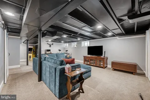 a bathroom with a sink mirror and toilet