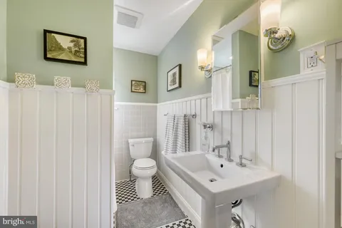 a view of workspace with wooden floor and windows