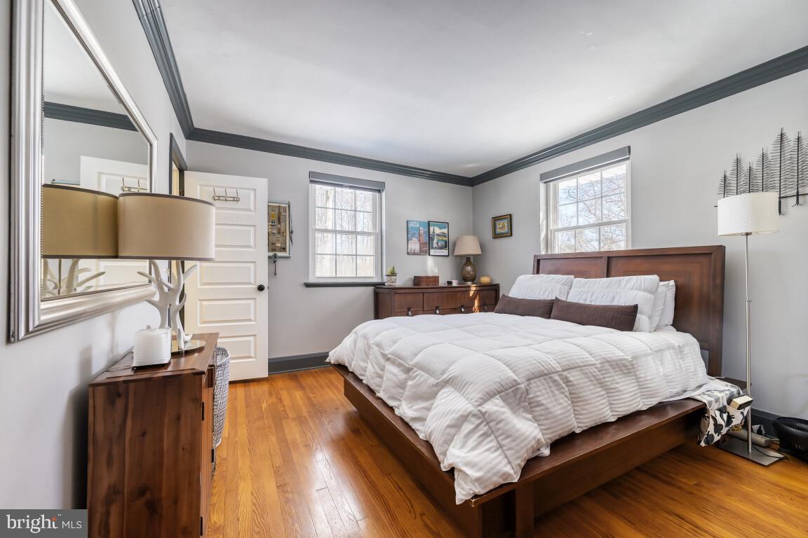 626 Ridgewood Road Bel Air, MD 21014 - Photo 24 of 33 a bedroom with a bed and wooden floor