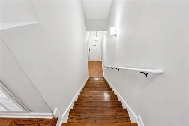 a view of a hallway with stairs