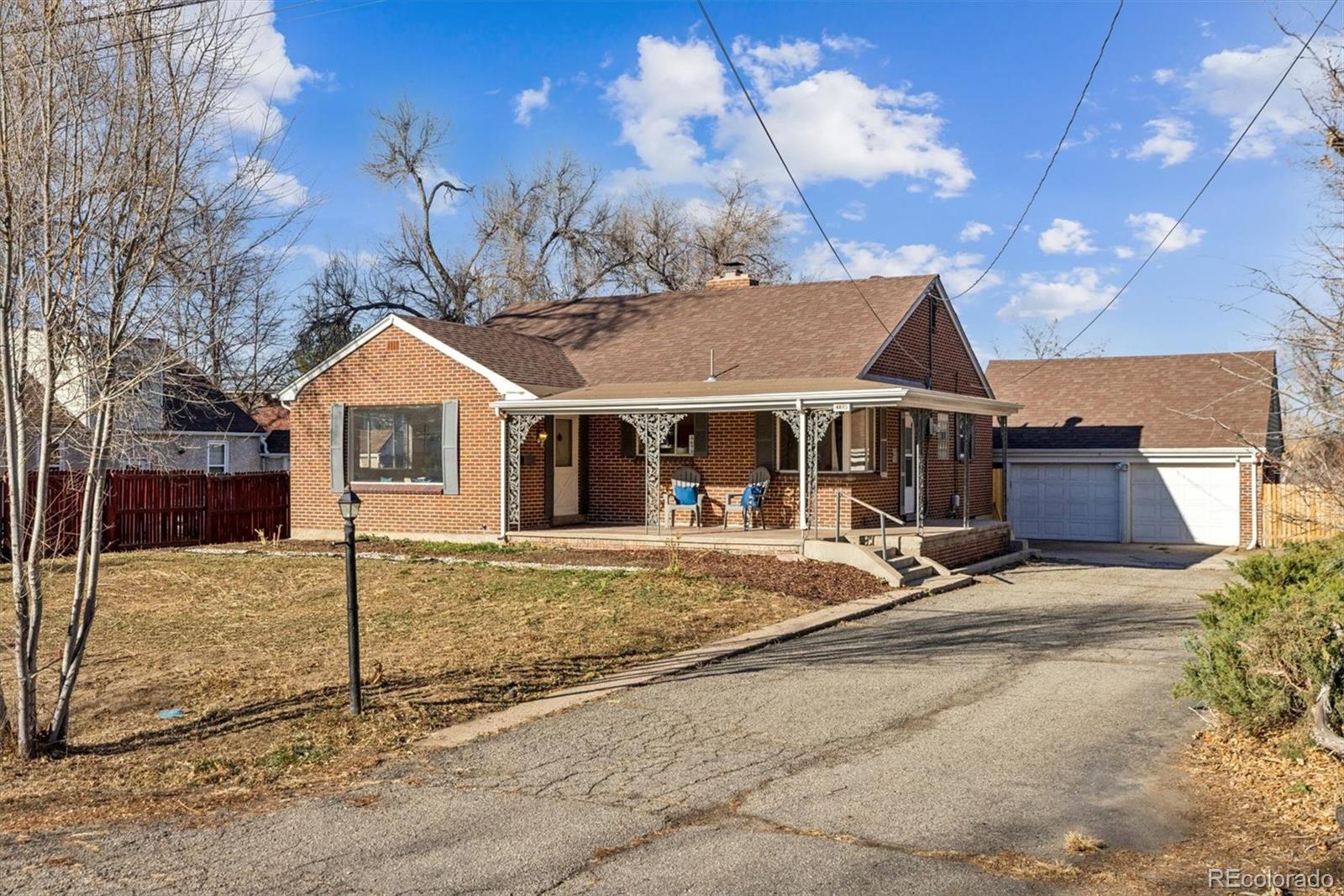 4675 Balsam Street Wheat Ridge, CO 80033 - Photo 1 of 30 a front view of a house with garden