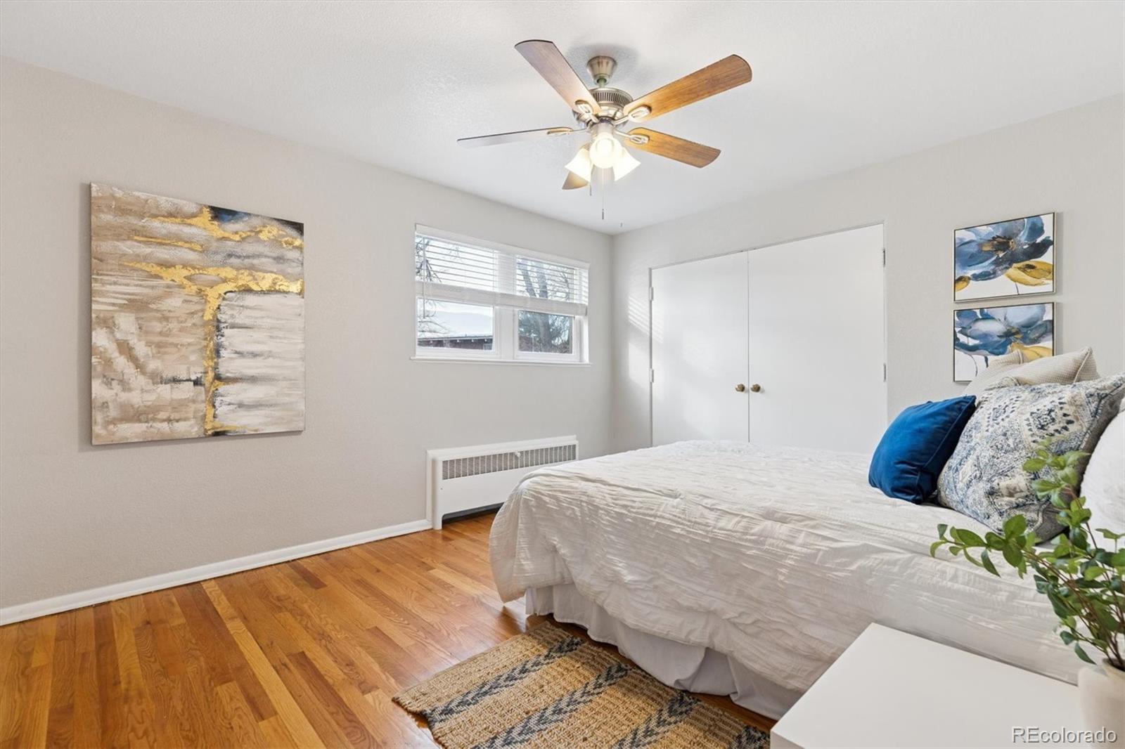 4675 Balsam Street Wheat Ridge, CO 80033 - Photo 16 of 30 a bedroom with a large bed and a window