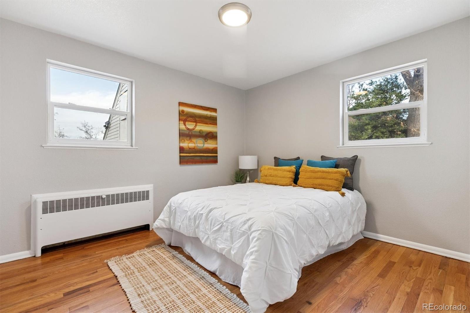 4675 Balsam Street Wheat Ridge, CO 80033 - Photo 18 of 30 a bedroom with a bed and a window