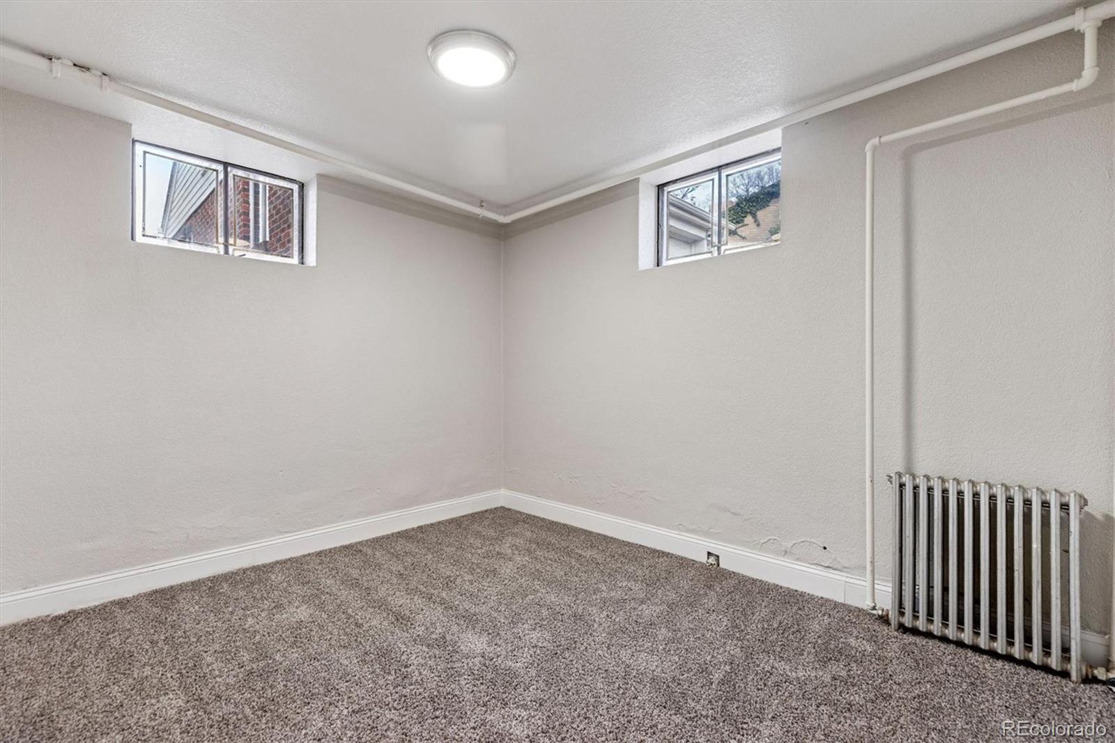 4675 Balsam Street Wheat Ridge, CO 80033 - Photo 24 of 30 an empty room with windows