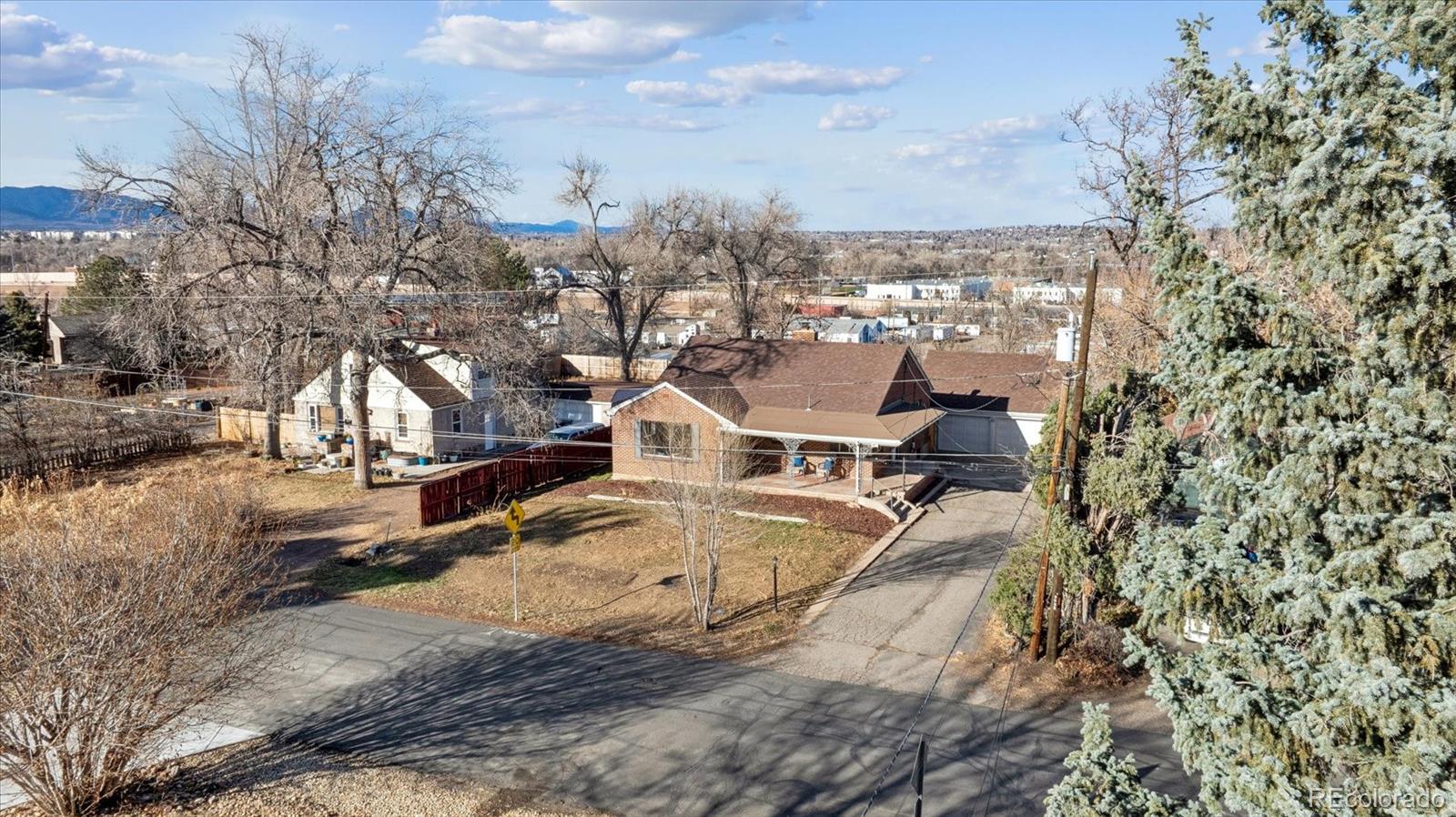 4675 Balsam Street Wheat Ridge, CO 80033 - Photo 29 of 30 a view of a house with a yard and sitting area