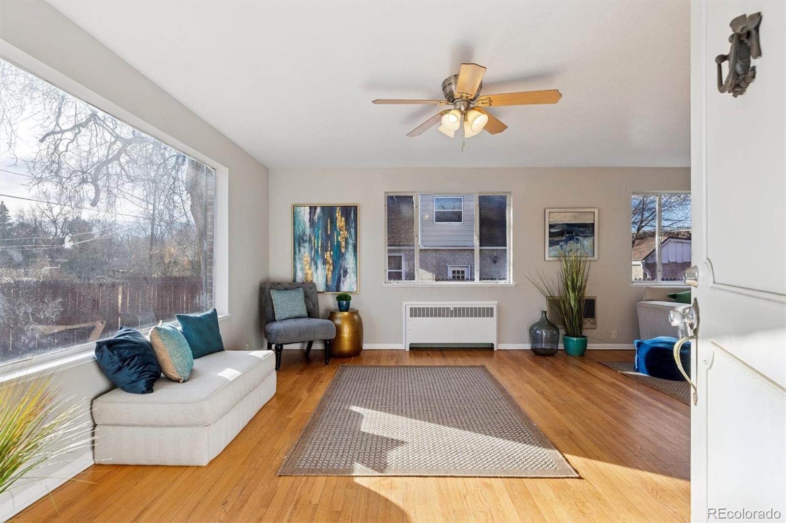 4675 Balsam Street Wheat Ridge, CO 80033 - Photo 4 of 30 a living room with furniture and a large window