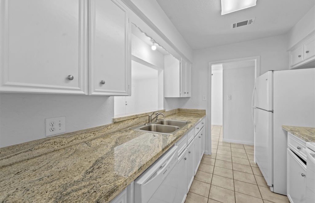 3428 Lantern Lane Baytown, TX 77521 - Photo 6 of 10 Open view to living area from kitchen window