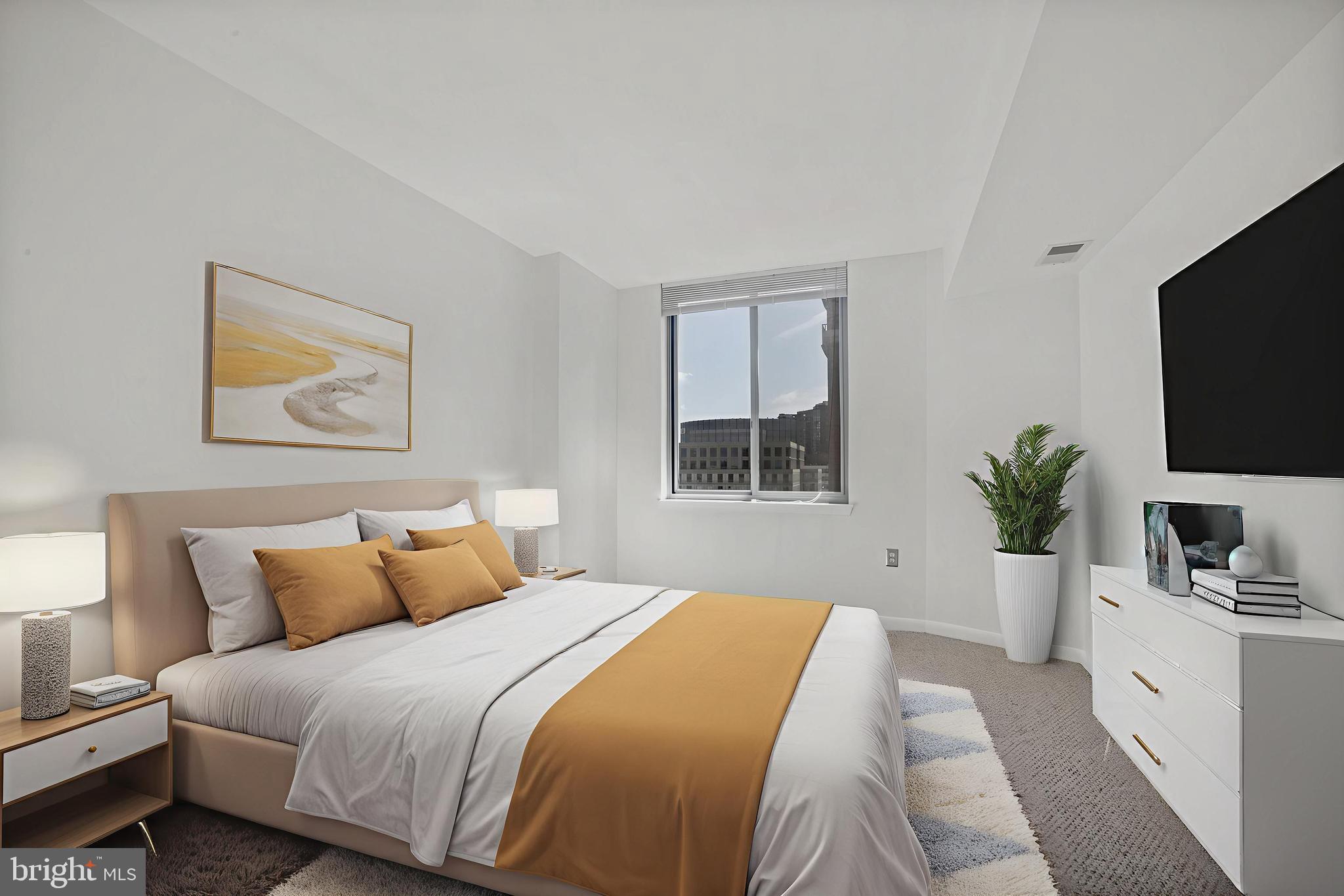 851 North Glebe Road, Unit 1608 Arlington, VA 22203 - Photo 11 of 24 a bedroom with a large bed and a flat screen tv