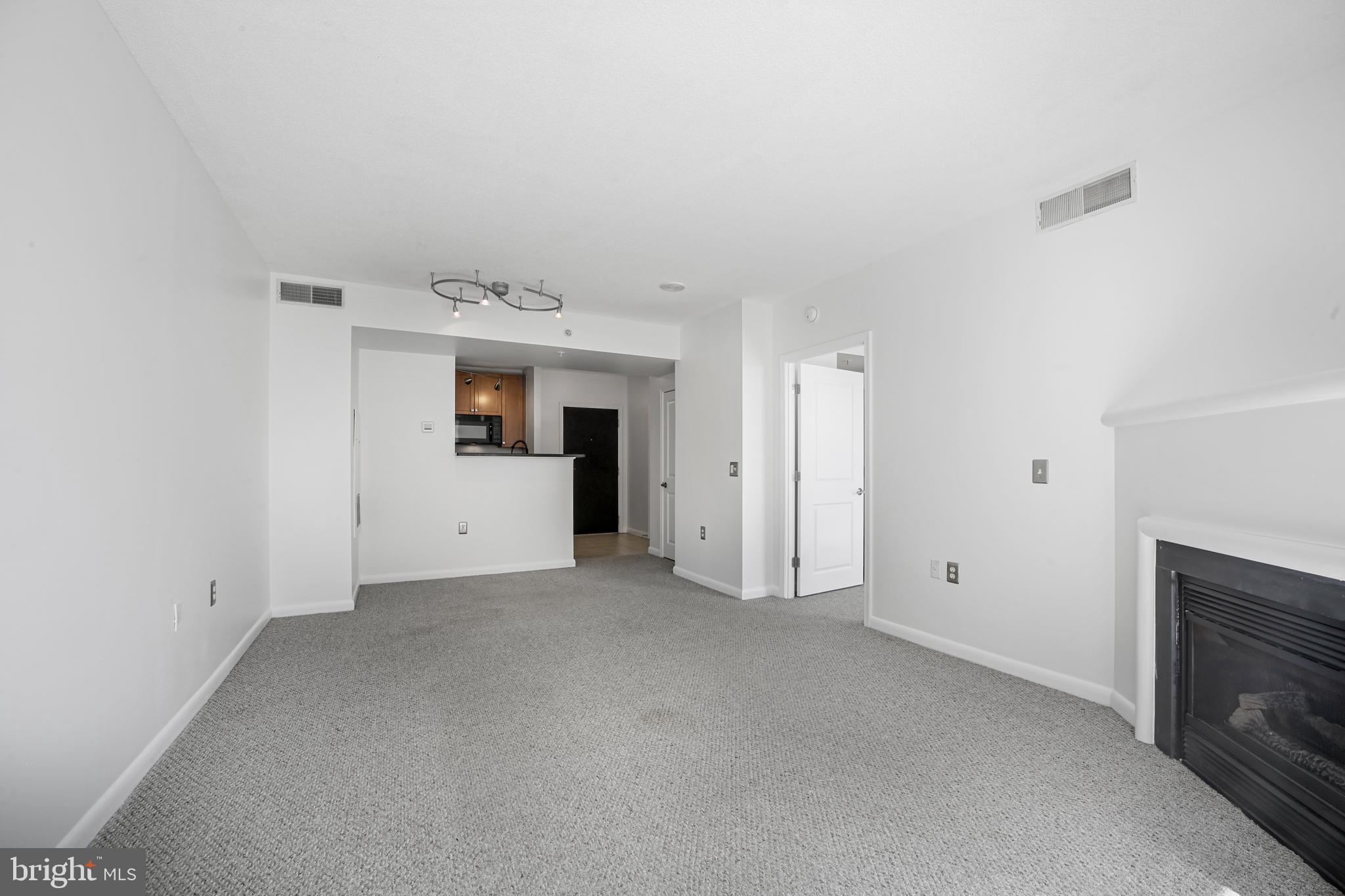 851 North Glebe Road, Unit 1608 Arlington, VA 22203 - Photo 6 of 24 a view of empty room with a fireplace