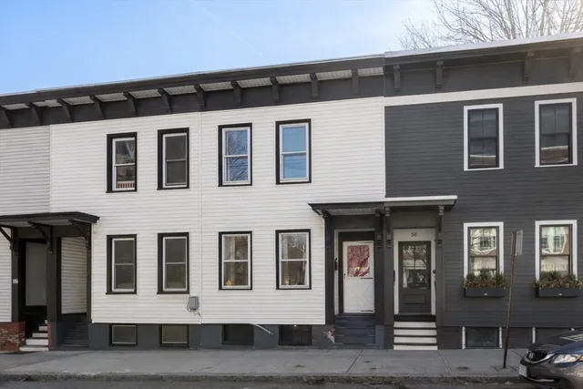 a front view of a house with a lots of windows