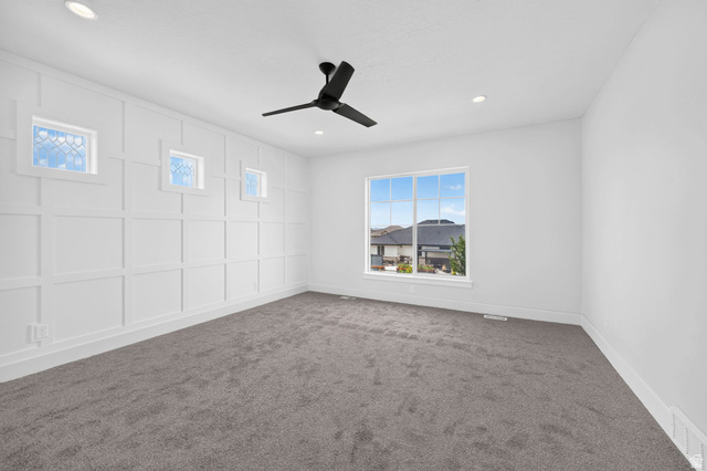 1002 West Temple Rim Lane Payson, UT 84651 - Photo 26 of 68 Spacious room featuring a large picture window, recessed lighting, and a modern ceiling fan