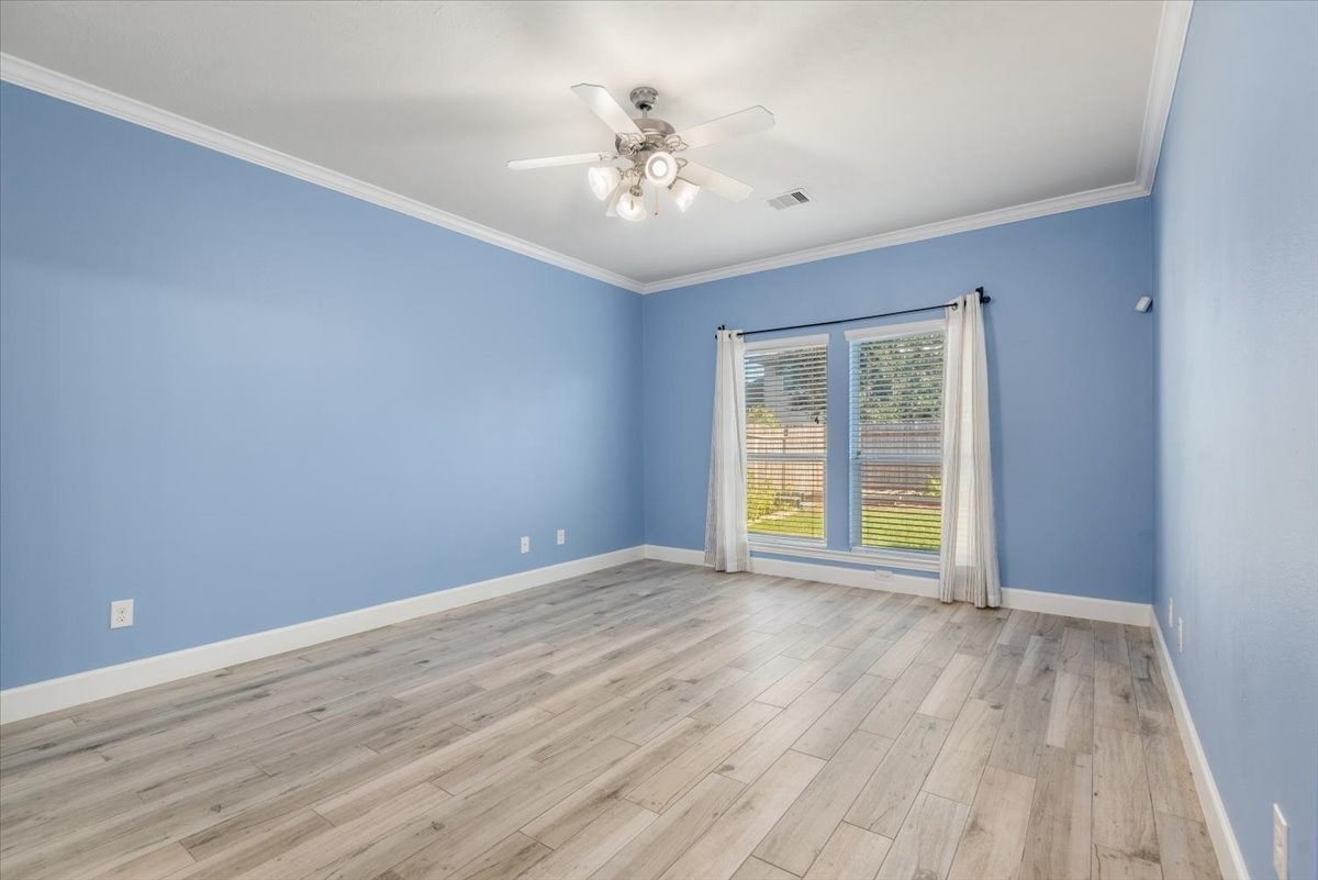 8203 Rudy Brook Way Spring, TX 77379 - Photo 18 of 37 wooden floor in an empty room with a window