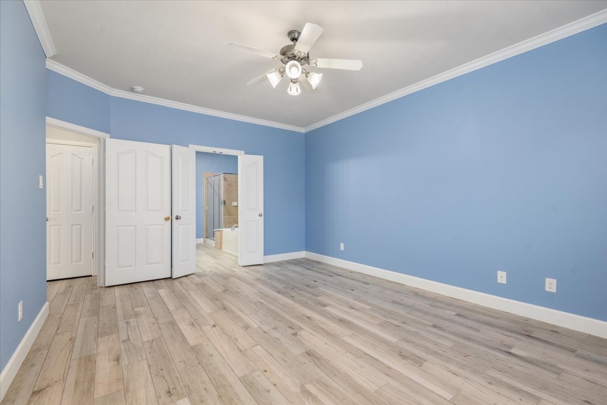 8203 Rudy Brook Way Spring, TX 77379 - Photo 19 of 37 wooden floor in an empty room with a window