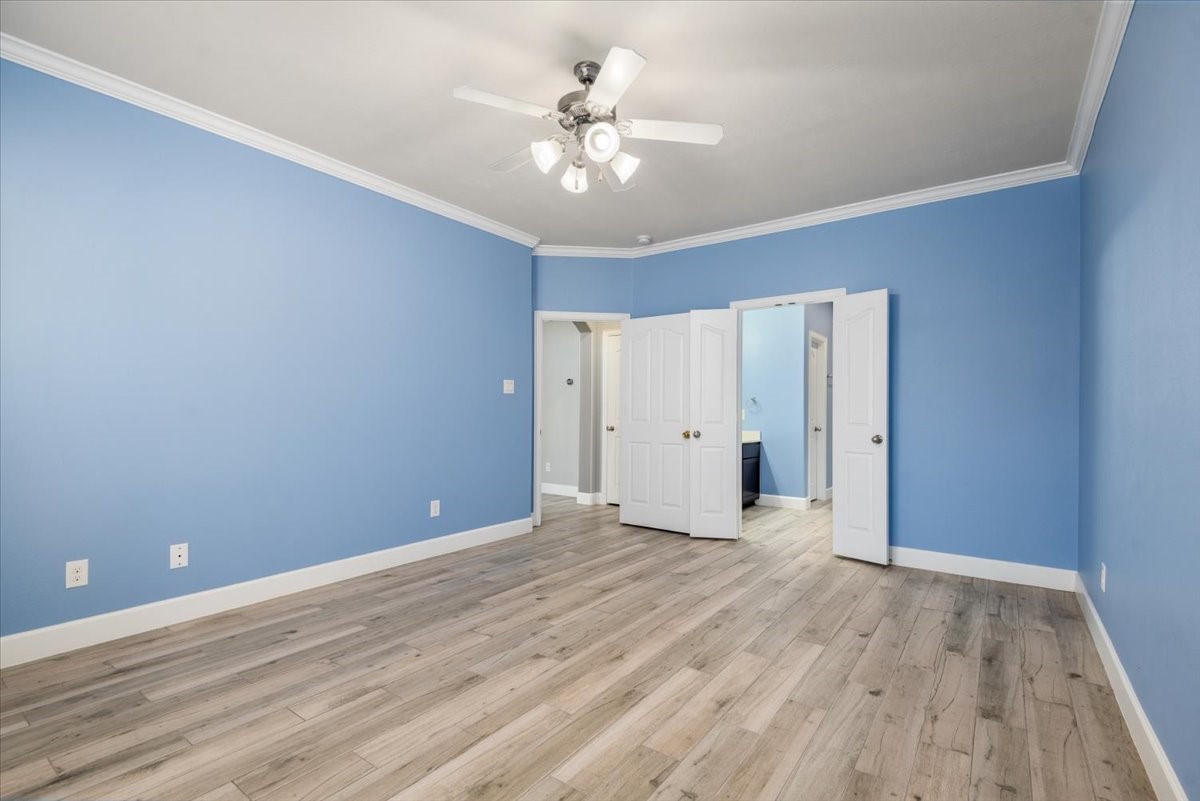 8203 Rudy Brook Way Spring, TX 77379 - Photo 21 of 37 a view of an empty room with wooden floor