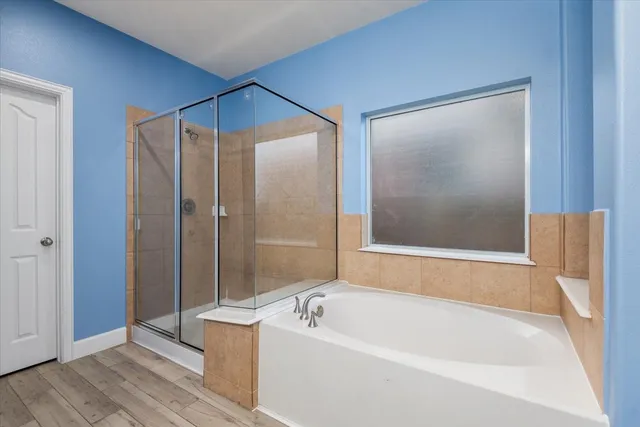a bathroom with double vanity sinks and a mirror