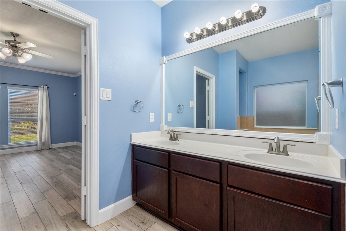 8203 Rudy Brook Way Spring, TX 77379 - Photo 25 of 37 a bathroom with double vanity sinks and a mirror
