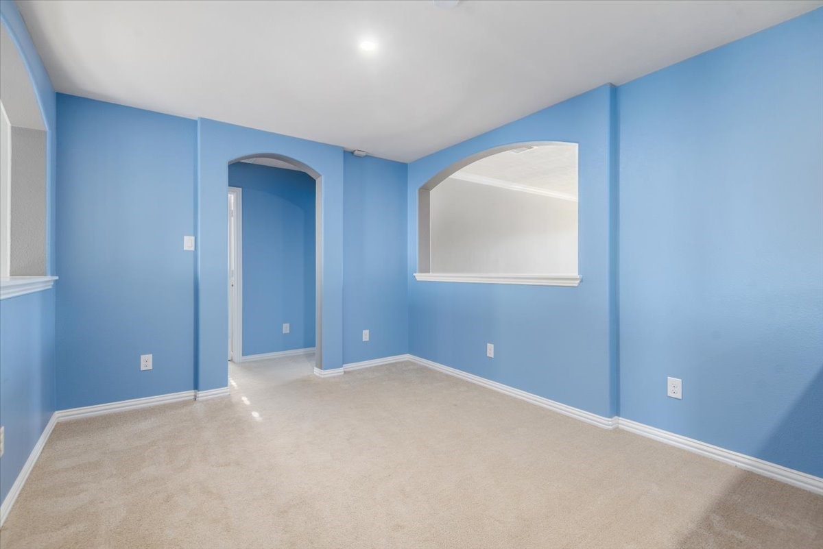 8203 Rudy Brook Way Spring, TX 77379 - Photo 28 of 37 an empty room with windows and closet