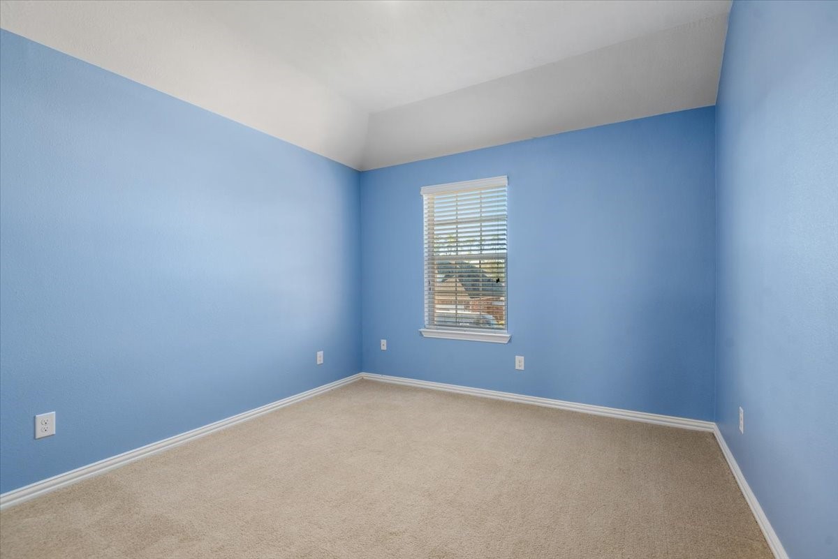 8203 Rudy Brook Way Spring, TX 77379 - Photo 29 of 37 an empty room with a window