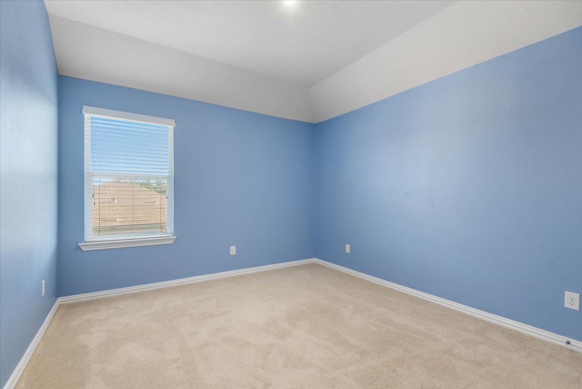 8203 Rudy Brook Way Spring, TX 77379 - Photo 32 of 37 an empty room with a window