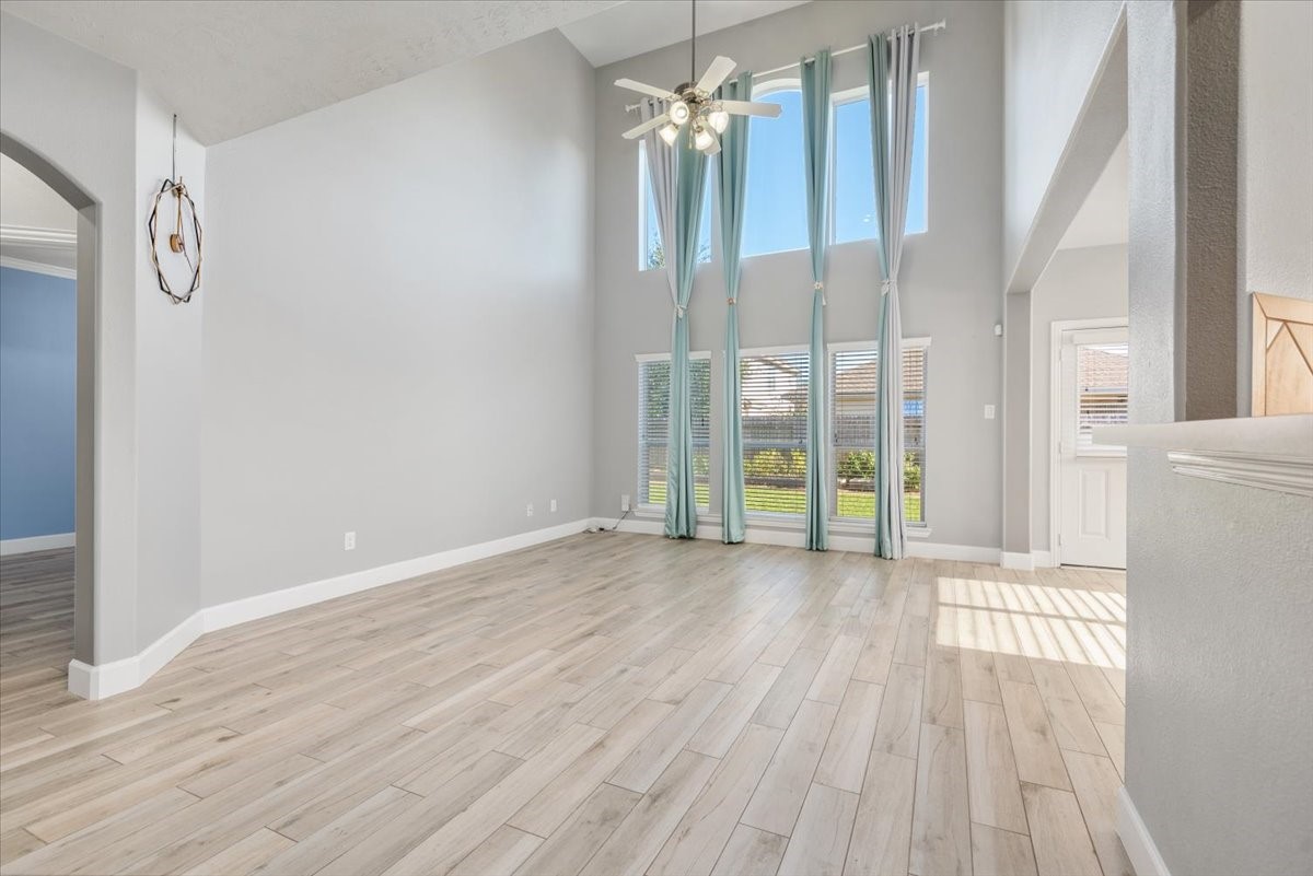 8203 Rudy Brook Way Spring, TX 77379 - Photo 8 of 37 a view of a room with wooden floor and windows