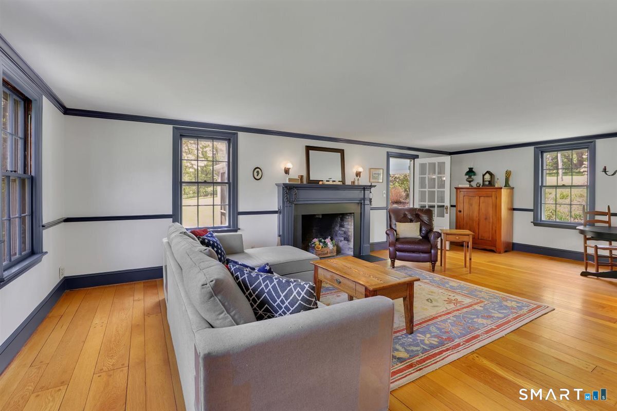 292 Parmelee Hill Road Durham, CT 06422 - Photo 17 of 39 The large scale of the living room offers flexible, and beautiful gathering space and features a fireplace and wide oak flooring