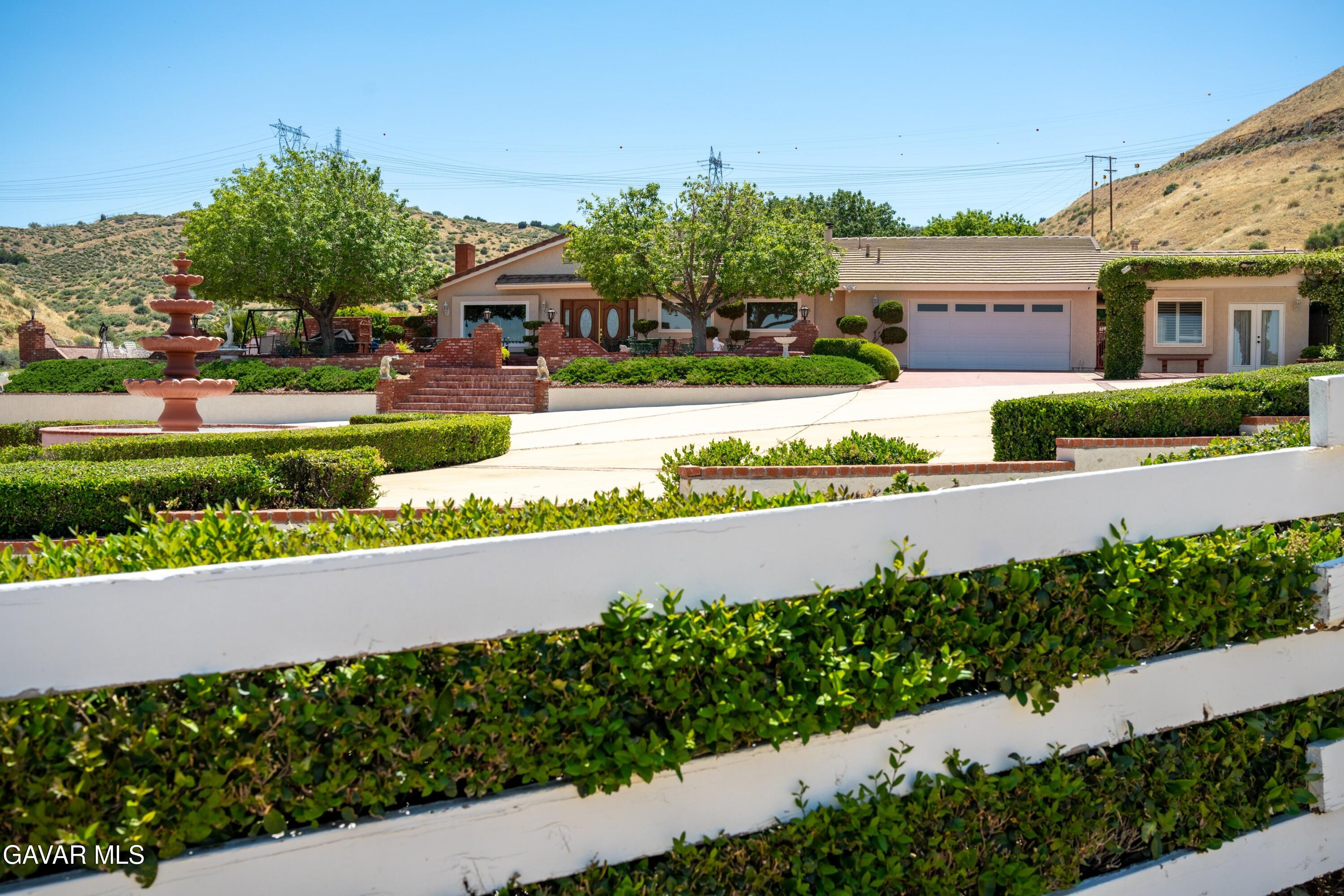 5801 Hacienda Ranch Road Palmdale, CA 93551 - Photo 10 of 69 a view of building with garden