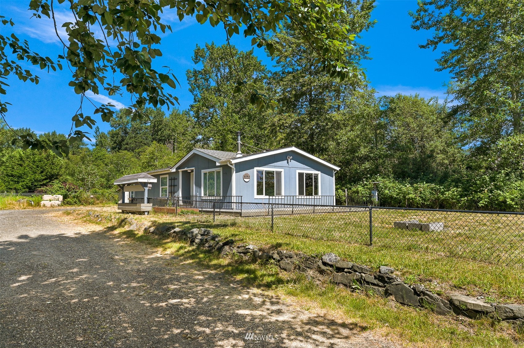 3053 Lummi Shore Road Bellingham, WA 98226 - Photo 1 of 37 a front view of a house with a yard