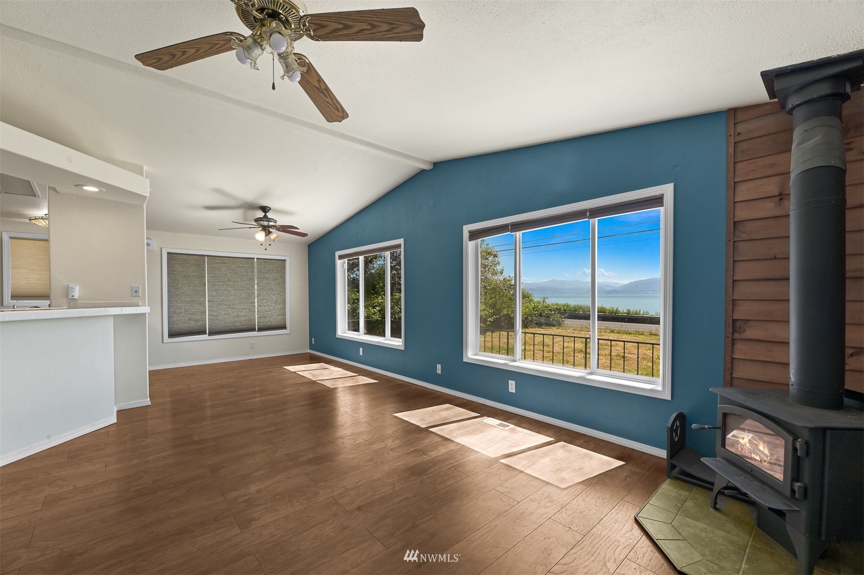3053 Lummi Shore Road Bellingham, WA 98226 - Photo 13 of 37 a view of an empty room with a window and wooden floor