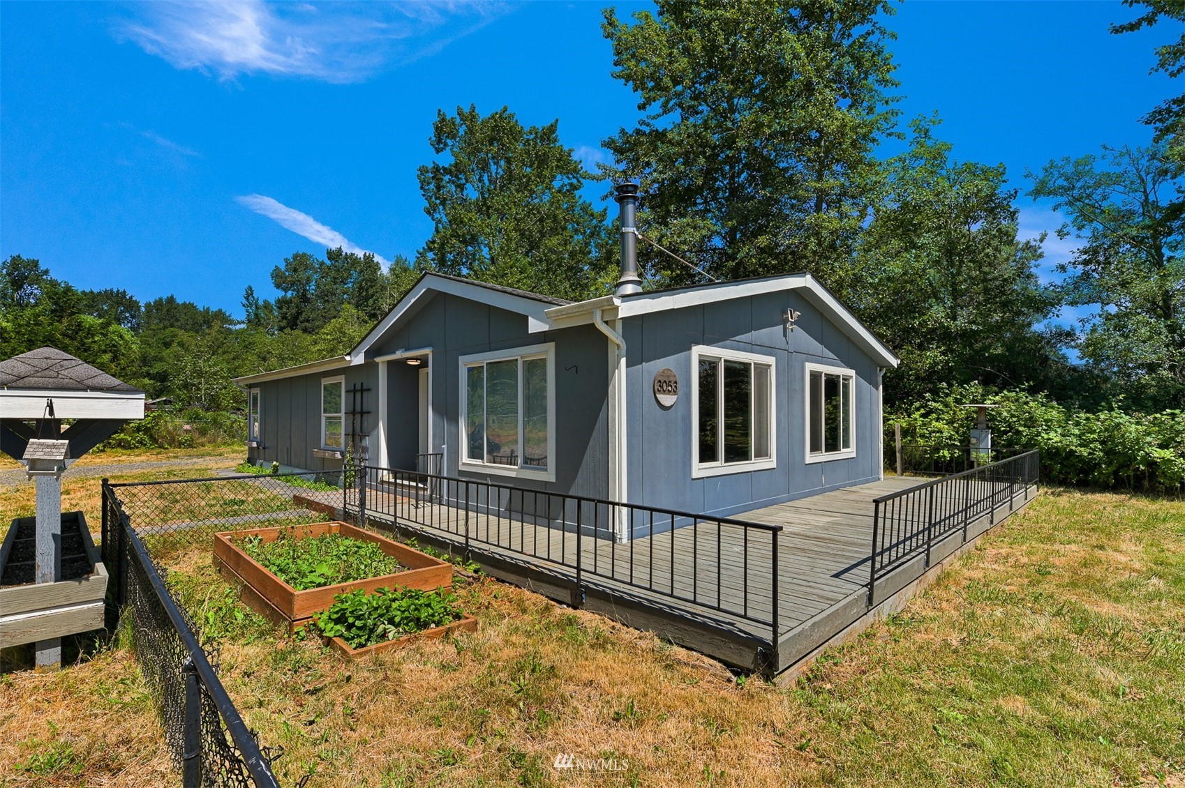 3053 Lummi Shore Road Bellingham, WA 98226 - Photo 2 of 37 a view of a house with a small yard and deck