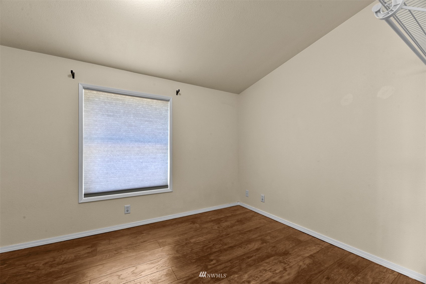 3053 Lummi Shore Road Bellingham, WA 98226 - Photo 23 of 37 an empty room with wooden floor and windows