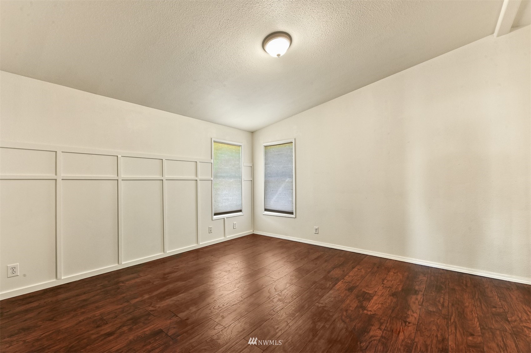 3053 Lummi Shore Road Bellingham, WA 98226 - Photo 28 of 37 an empty room with wooden floor and windows