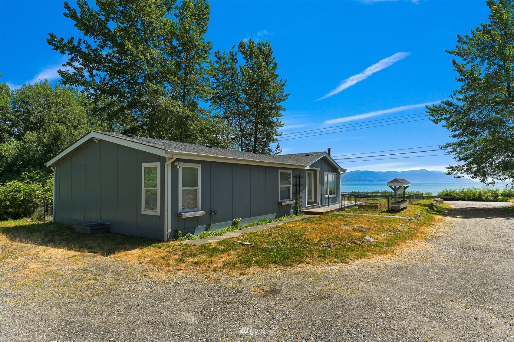 3053 Lummi Shore Road Bellingham, WA 98226 - Photo 33 of 37 a view of a house with a yard
